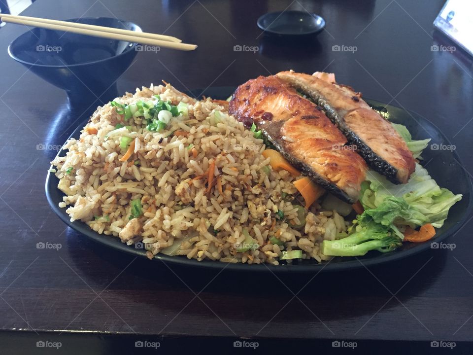 Japanese food. Salmon with rice and vegetables
