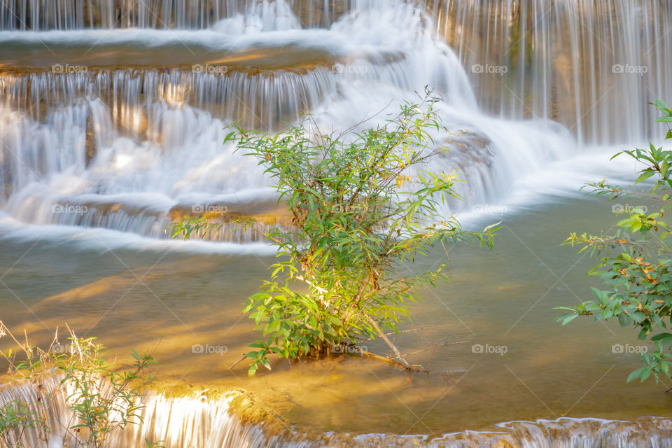 Waterfall flowing from the mountains at Huay Mae khamin waterfall National Park ,Kanchana buri in Thailand.