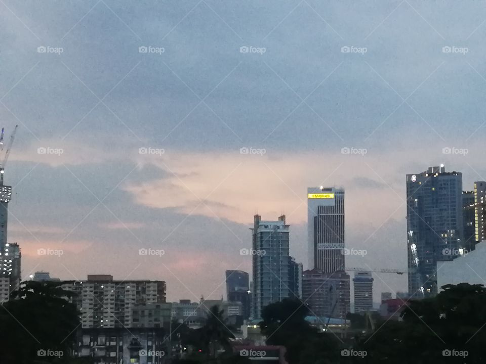Urban view with the evening sky that has bits of rose quartz and serenity (taken at Pudu LRT Station)