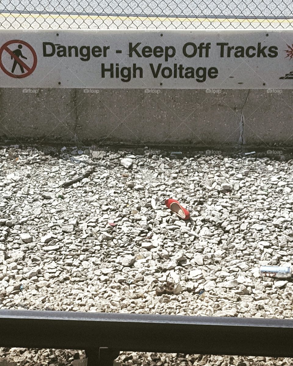 red shoe on train track