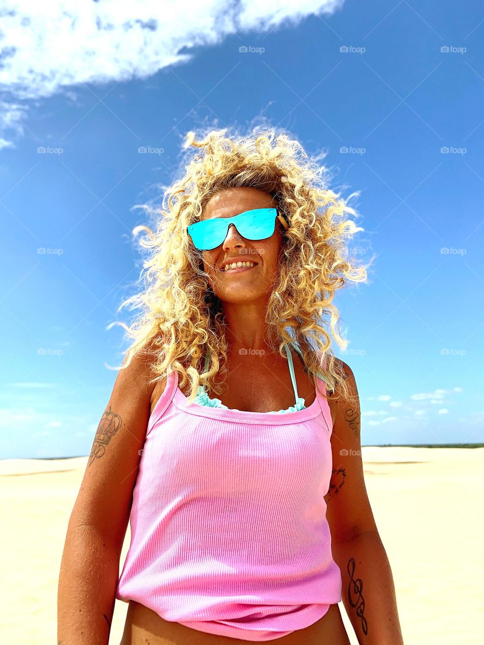 Woman with pink shirt against desert 