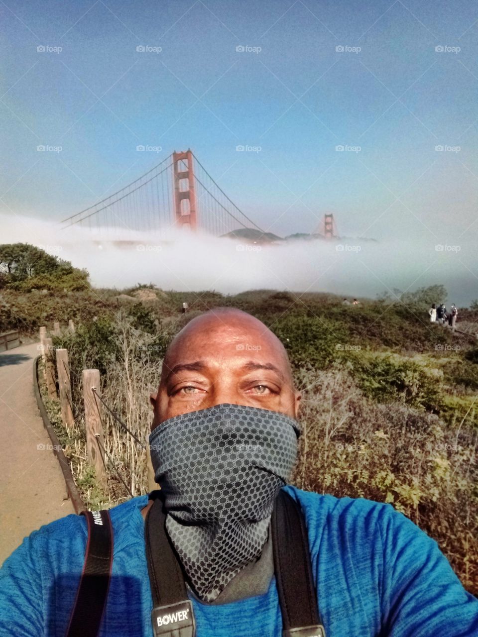 selfie pic, outdoors enjoying a spectacular view in San Francisco California with my face covering on.