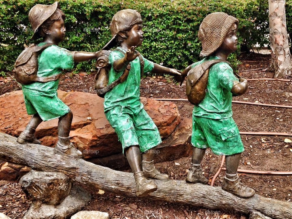 Ready....pull!. Statue of kids