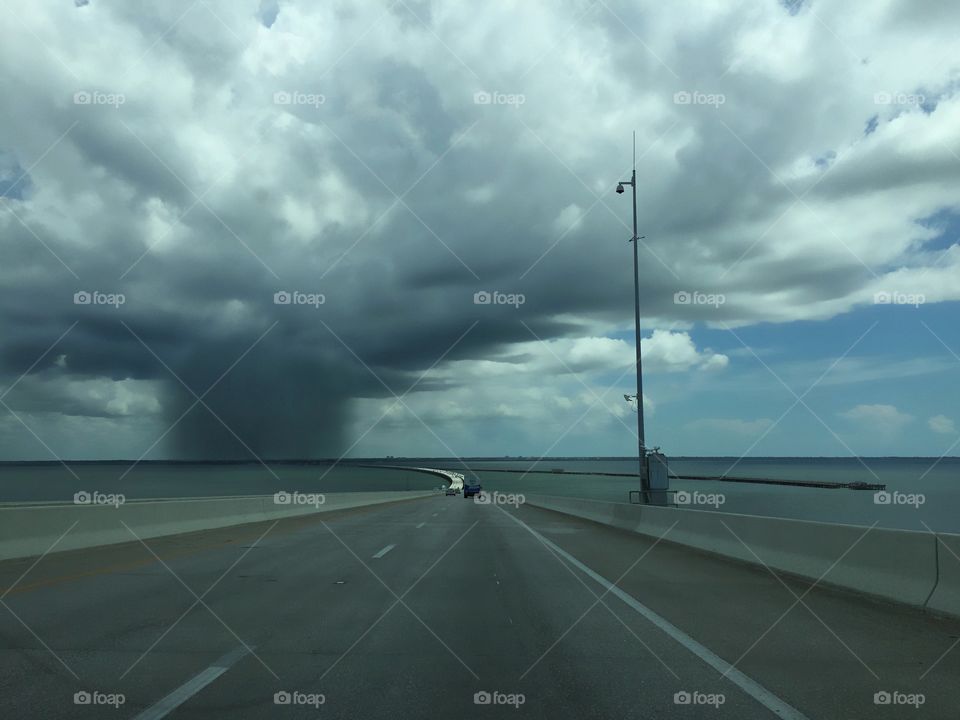 Heavy rainstorm approaching the highway.