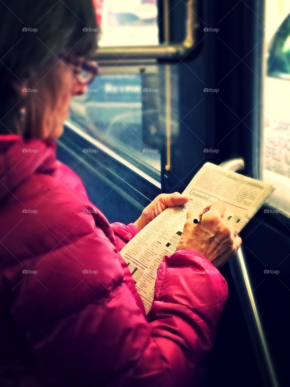 New York Times crossword puzzle on the bus