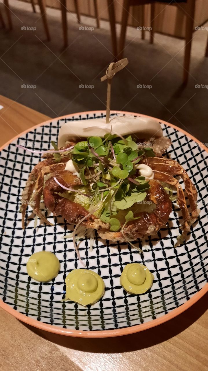 japanese fusion food of crab with sauce and vegetables