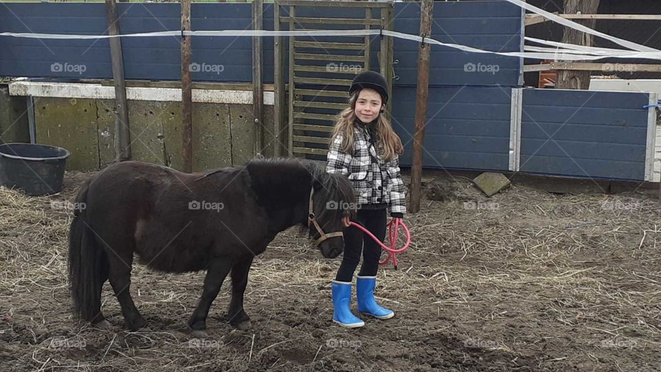 little girl with little horse