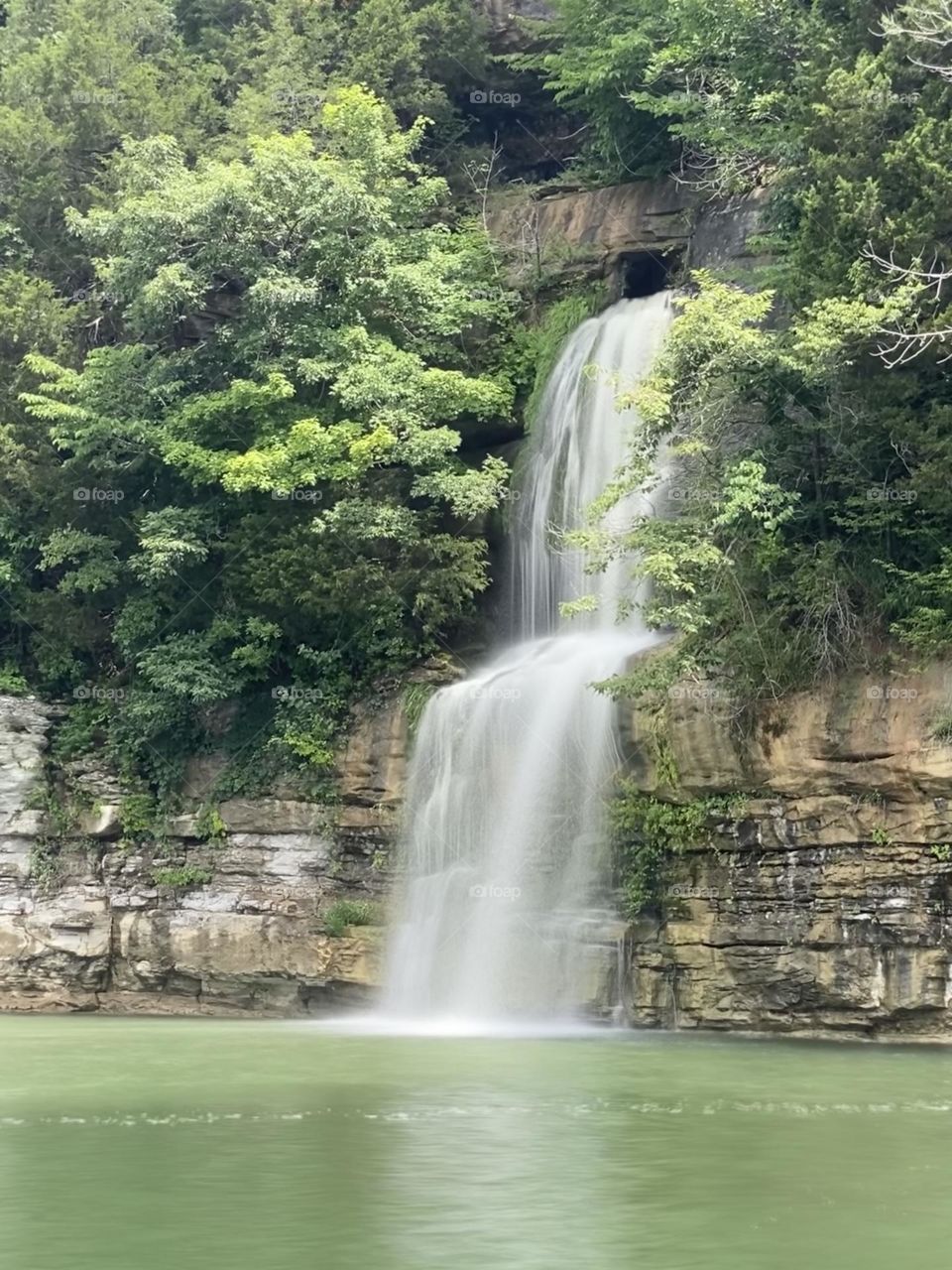 Long exposure of a cute rain fueled waterfall into Lake Cumberland in southern Kentucky in USA