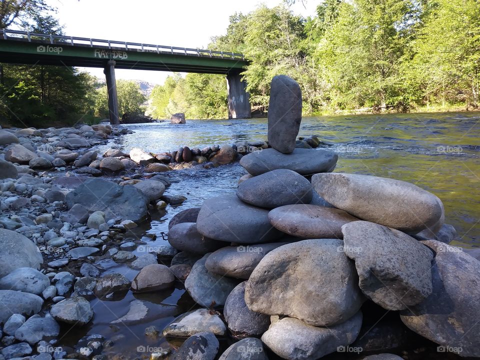 stacked rocks in a river