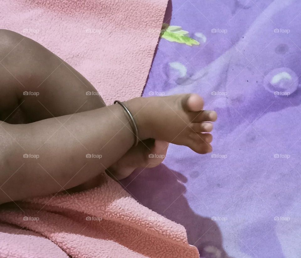 This beautiful β€οΈπ legs of two months baby girl π₯π. Baby is sleeping in her bed and playing joyfully with her toys!!πͺπ§Έ