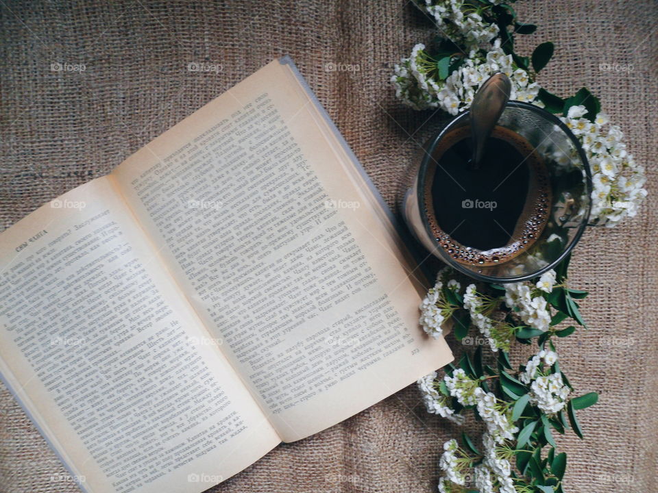 Coffee, flowers and a favorite book