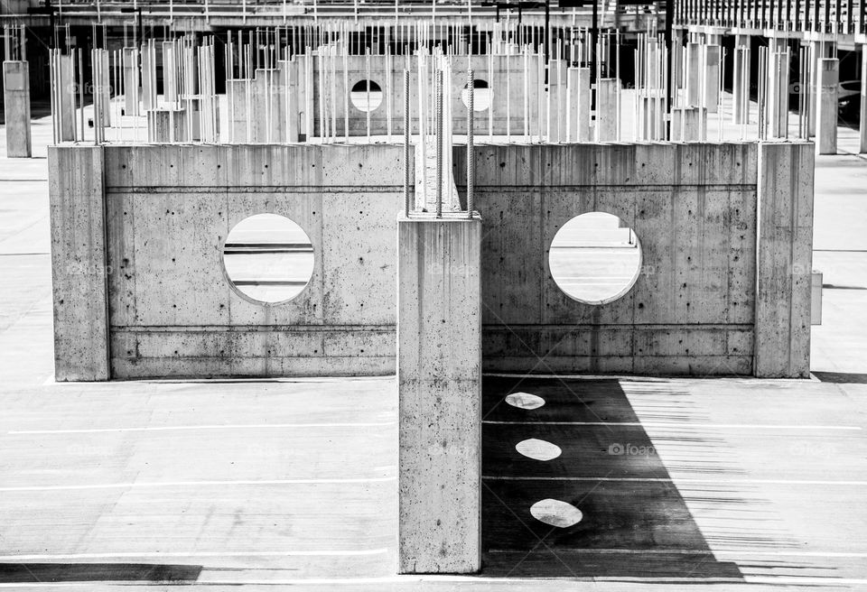 Black and white image of partial construction of cement architecture 