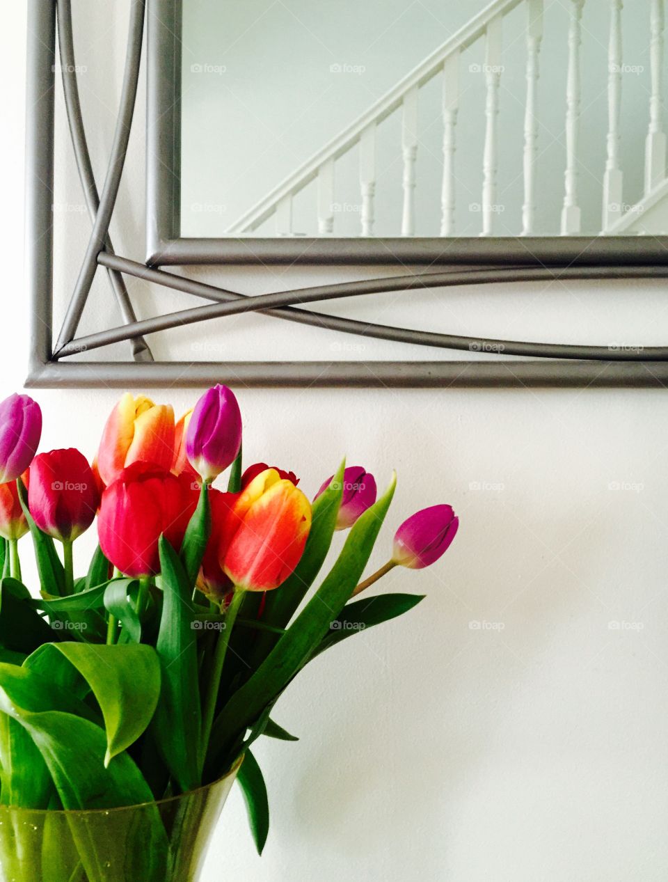 Fresh tulips mirror and staircase 