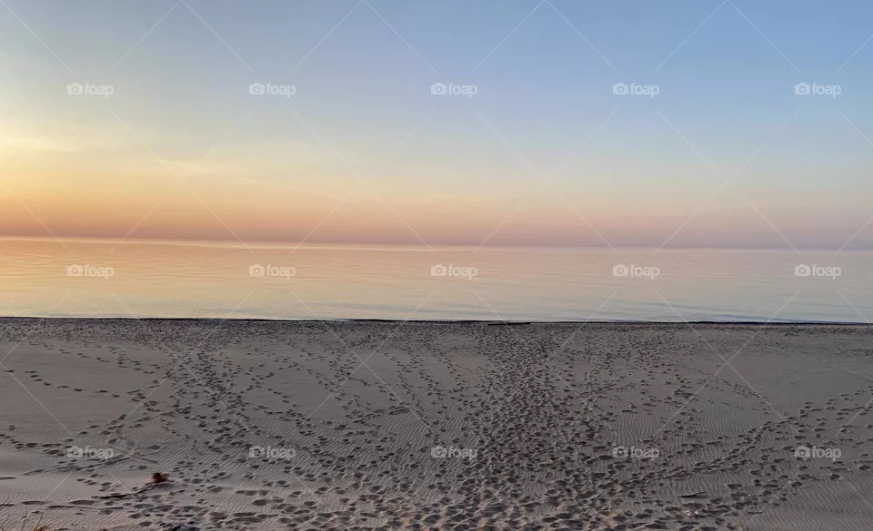 Sunset on a sandy beach on Lake Superior in the Upper peninsula  of Michigan