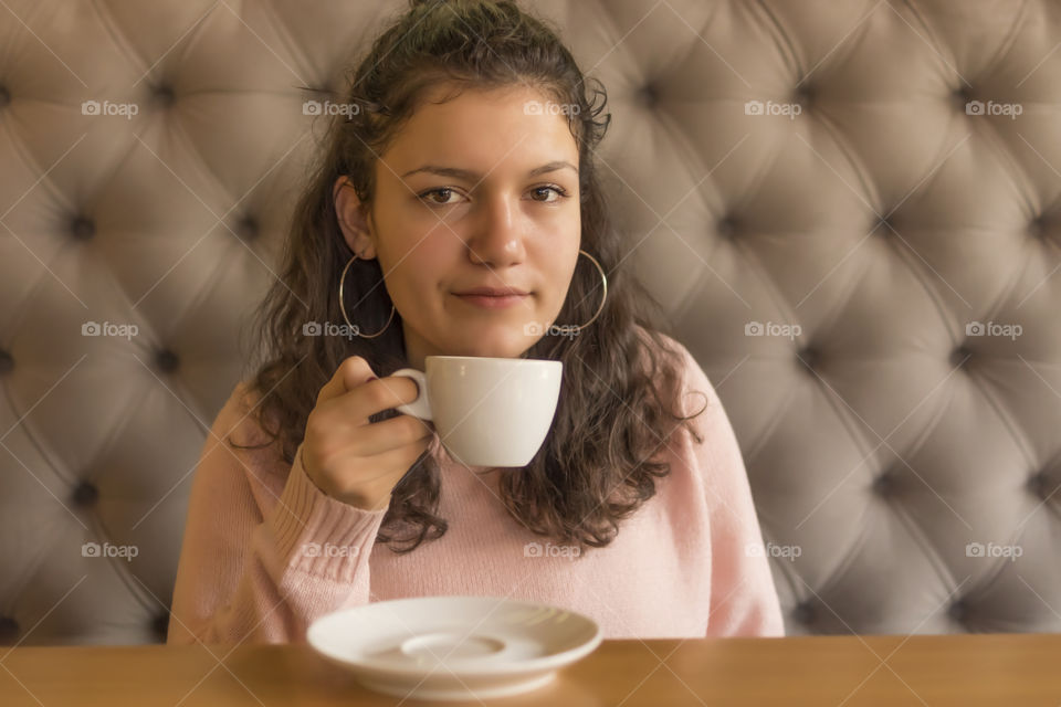A girl drinking coffee