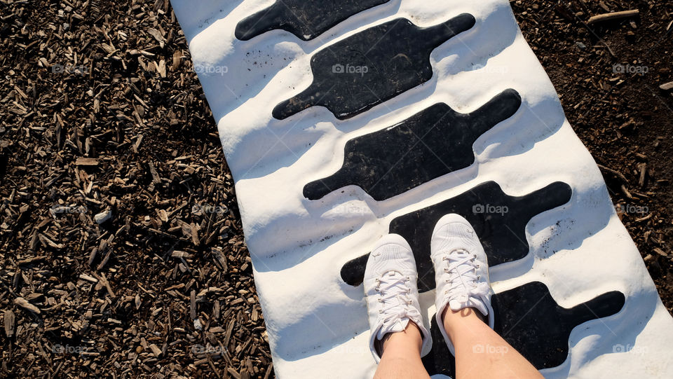 Feet treading on spine