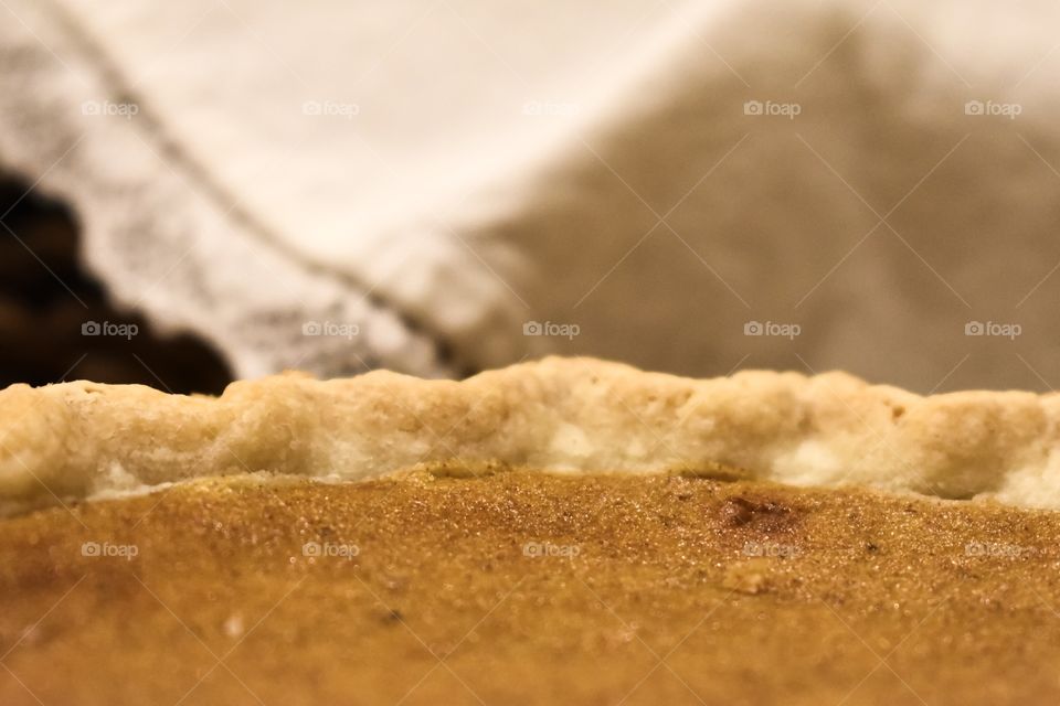 Freshly baked pumpkin pie on buffet table for Thanksgiving holiday feast 