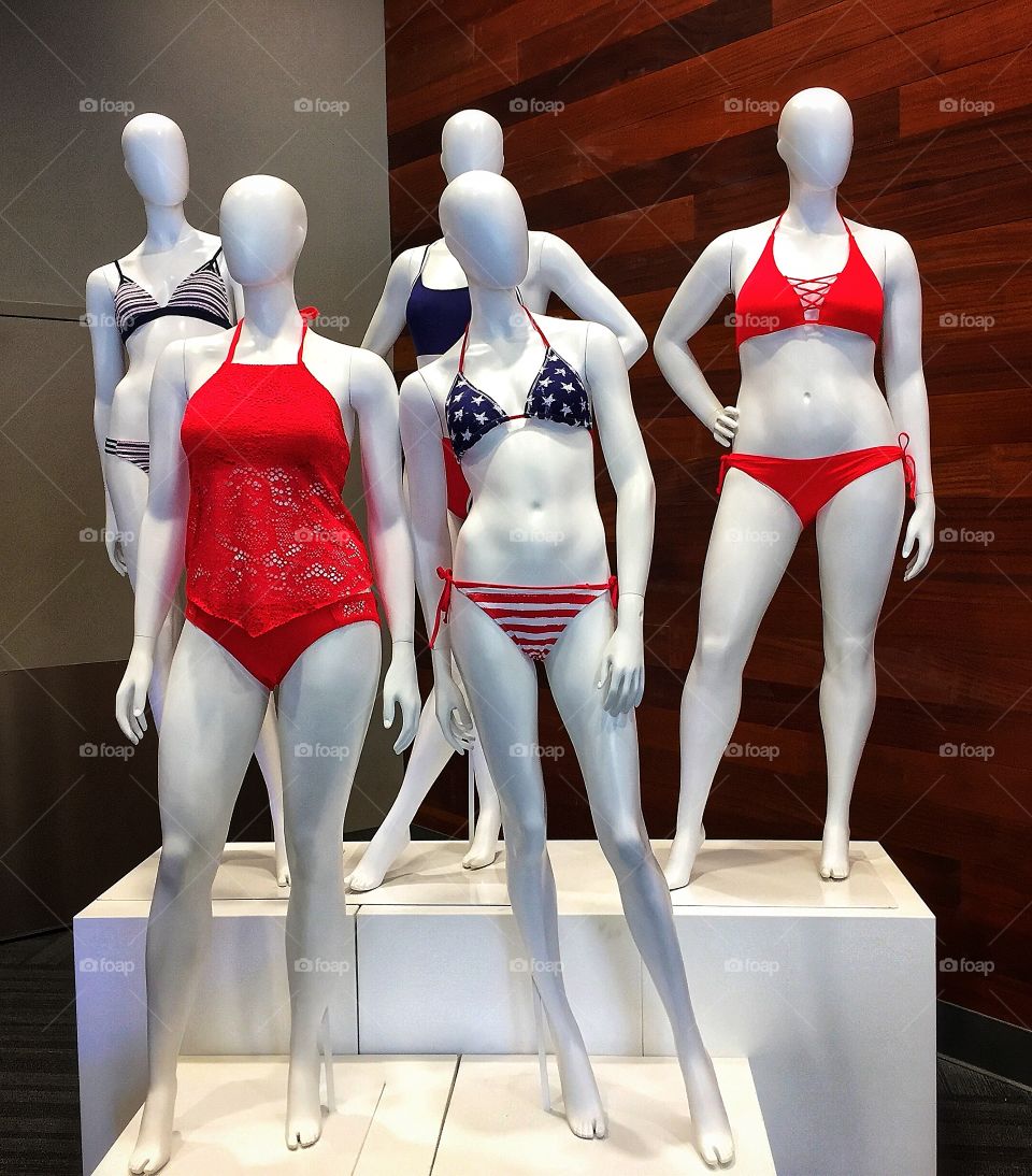 Faceless mannequins in bikinis and bathing suits