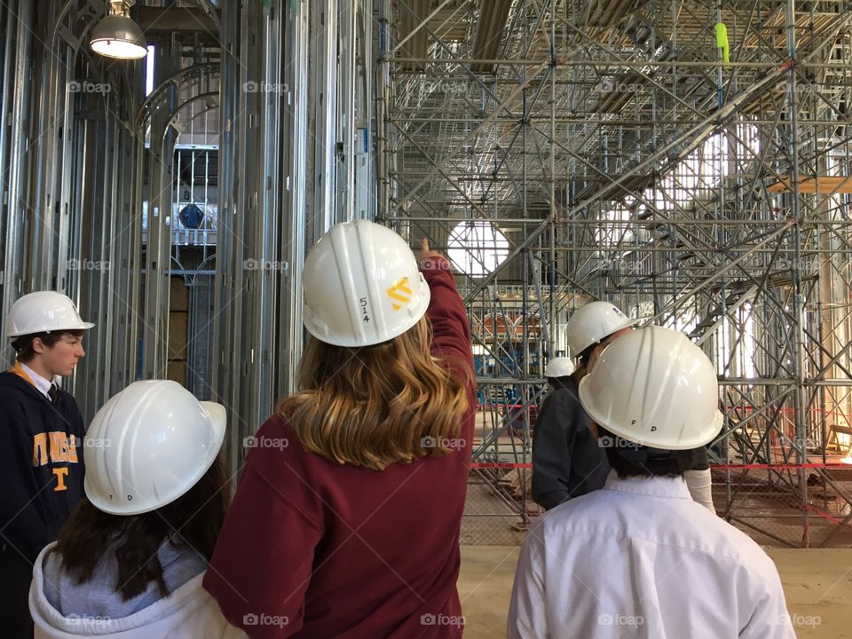 Students looking at an under construction cathedral