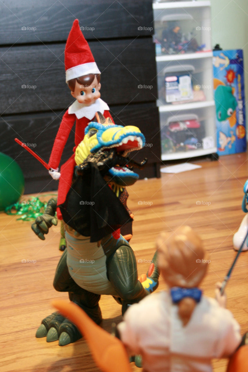elf on the shelf dinosaur fight