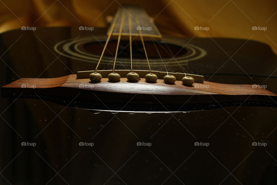 acoustic guitar on Golden textile