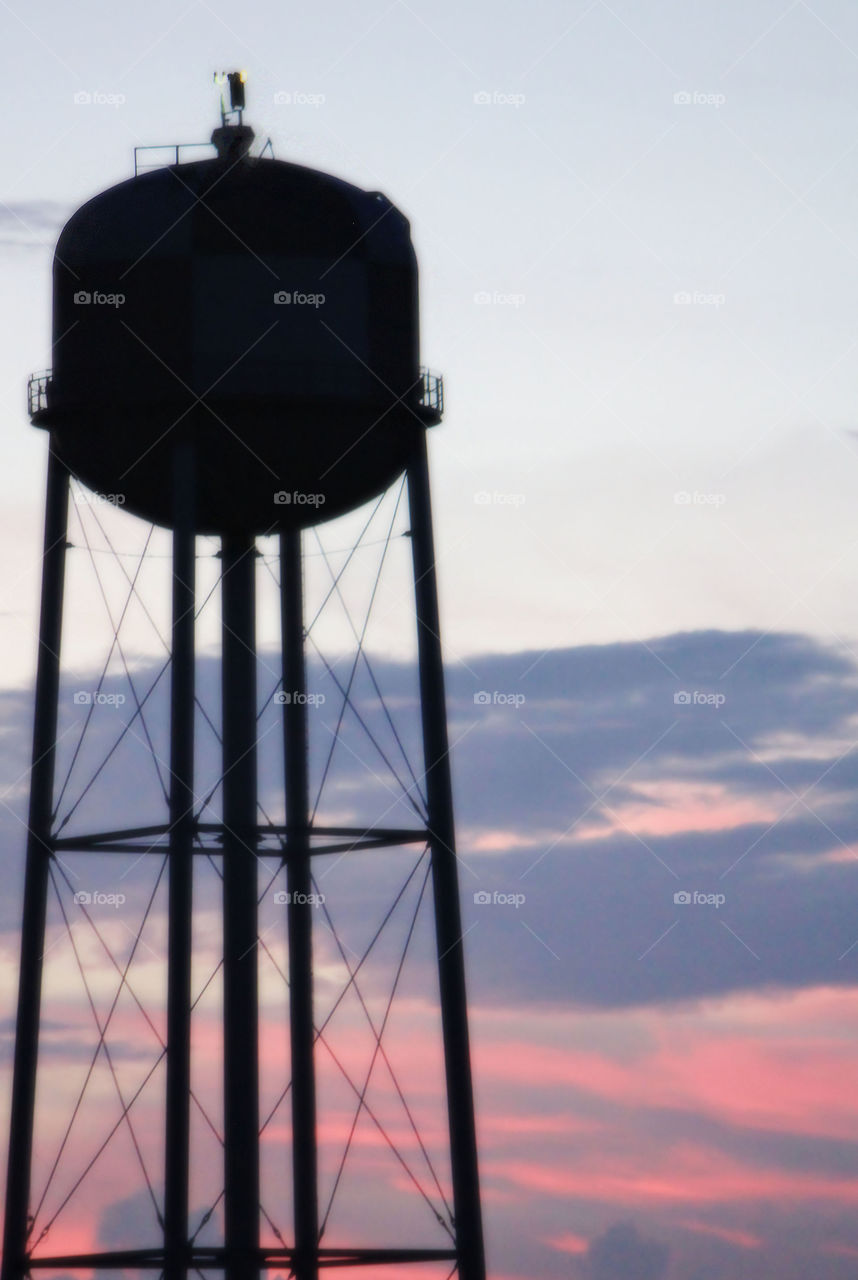 Sunset giving a water tower a Silhouette affect