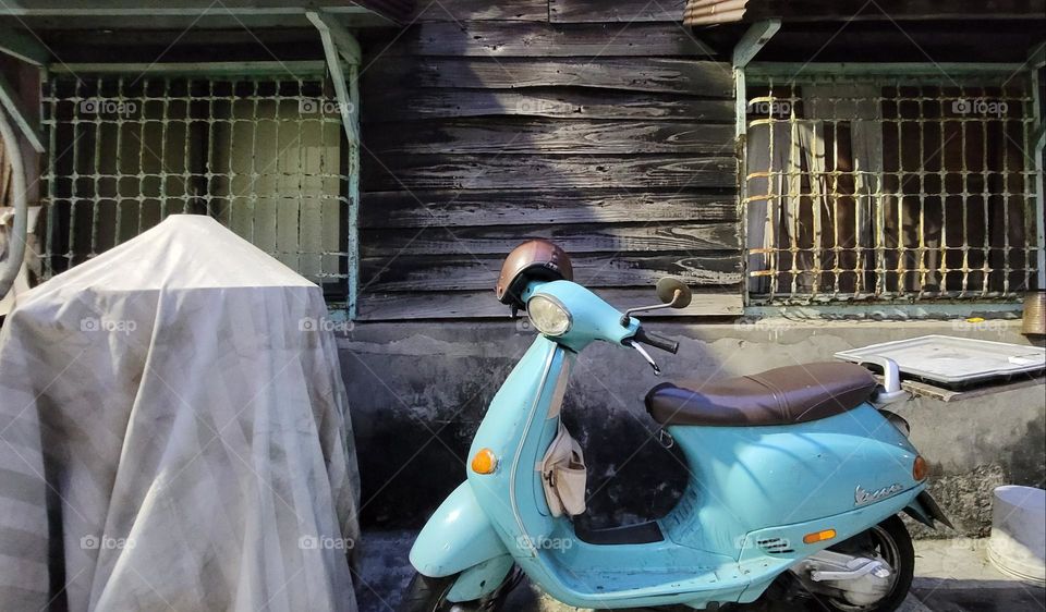 Retro motorcycles and wooden house.