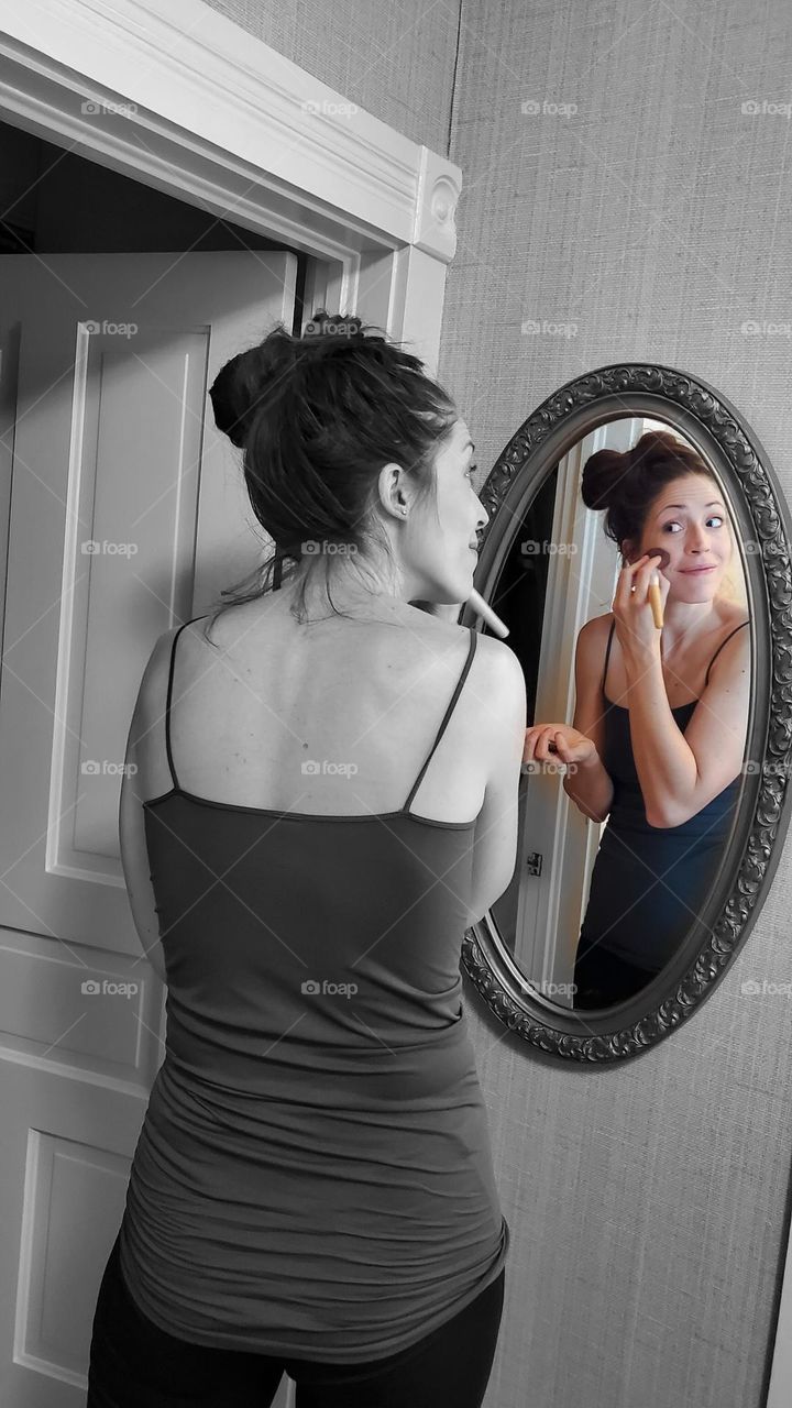 make up face in the mirror