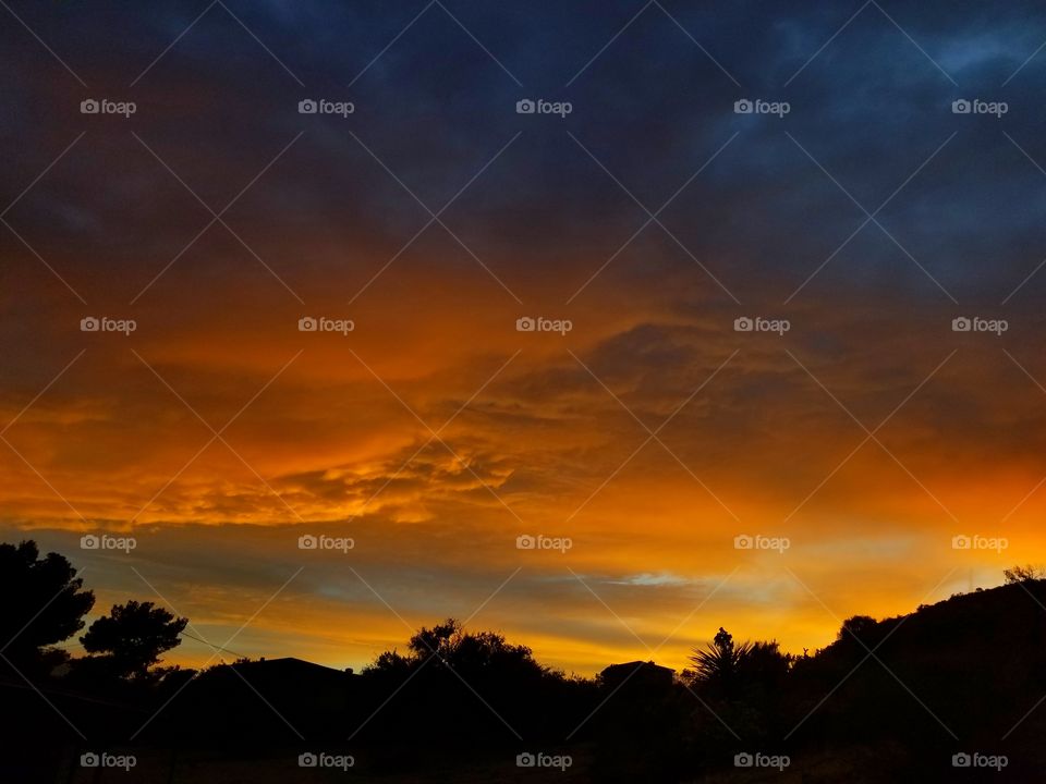 Orange Sunset Against a Dark Blue Sky