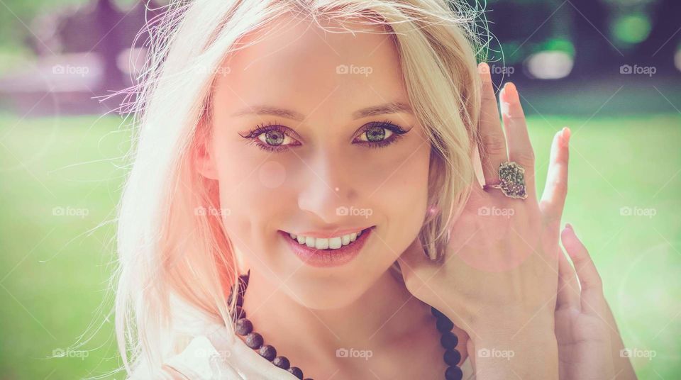 blonde girl showing ring