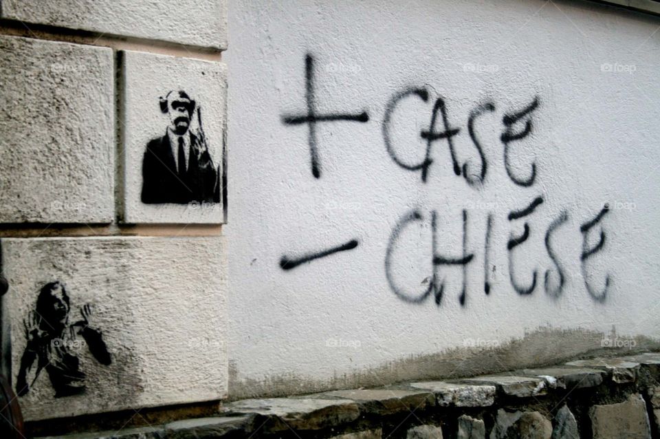 Graffiti in Diamanté, Calabria. Taken in the streets of Diamanté, Calabria in Southern Italy. 'Case' meaning houses and 'Chiese' meaning churches.