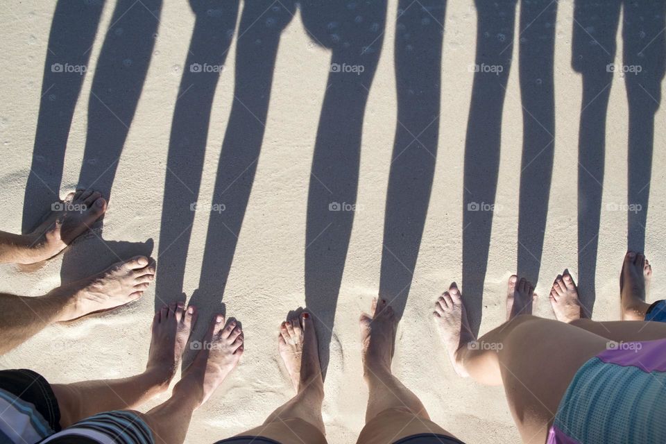 Feet and Shadows in the Sand