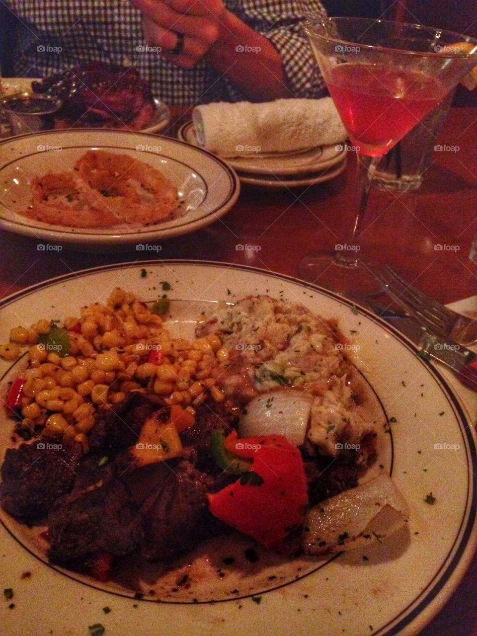 Plate of deliciousness. Dinner at a restaurant 
Steak tips, corn, mashed potatoes
