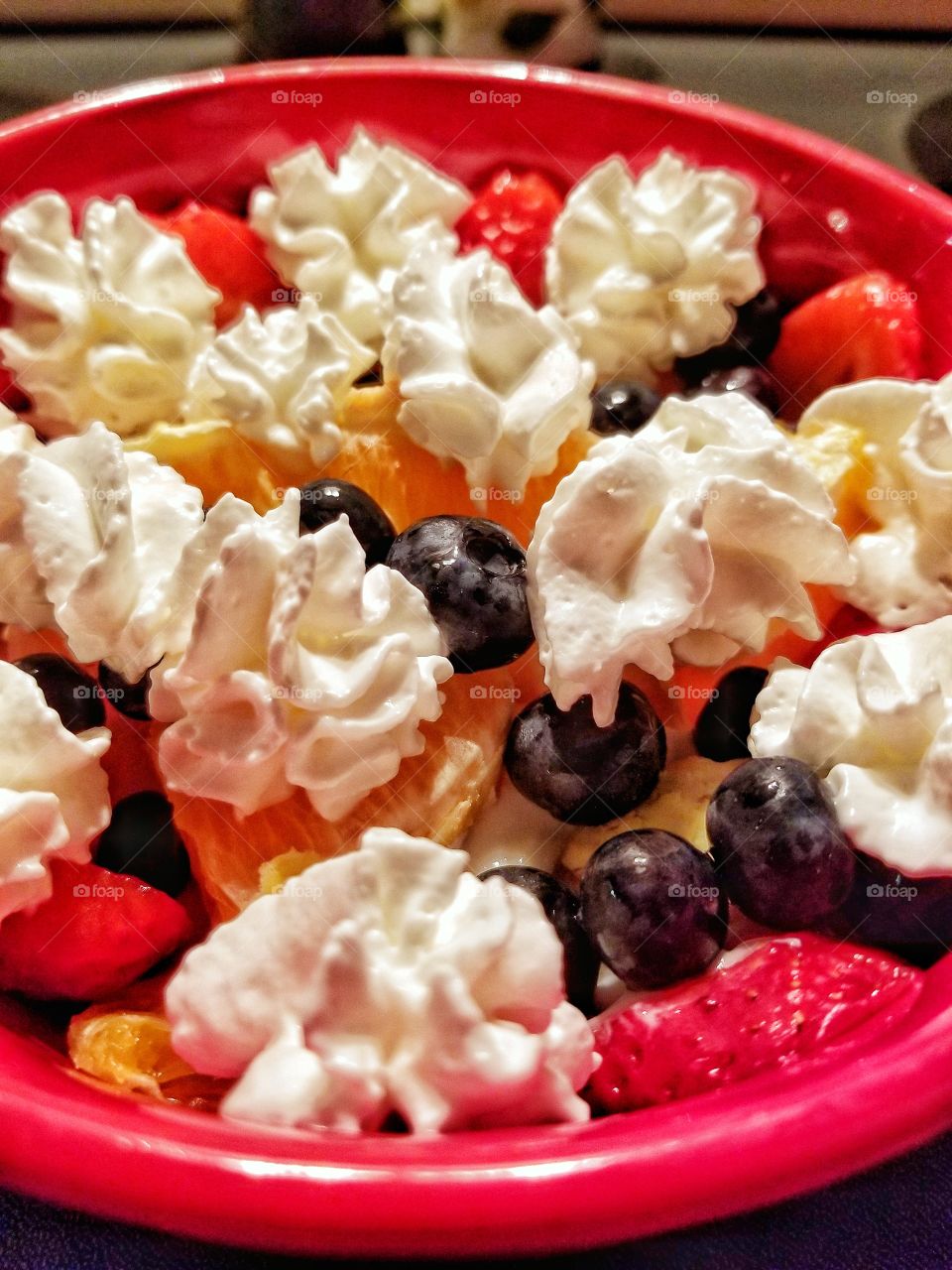 Berries and Oranges in a bowl for a healthy dessert everyone can love!