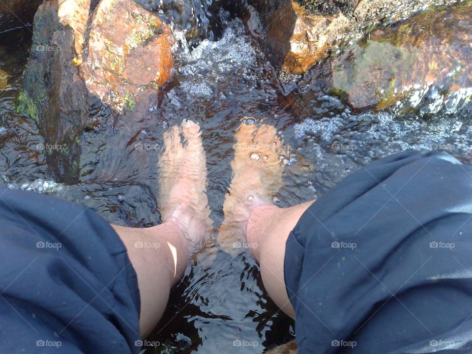 Cooling off hot feet in a cold mountain stream