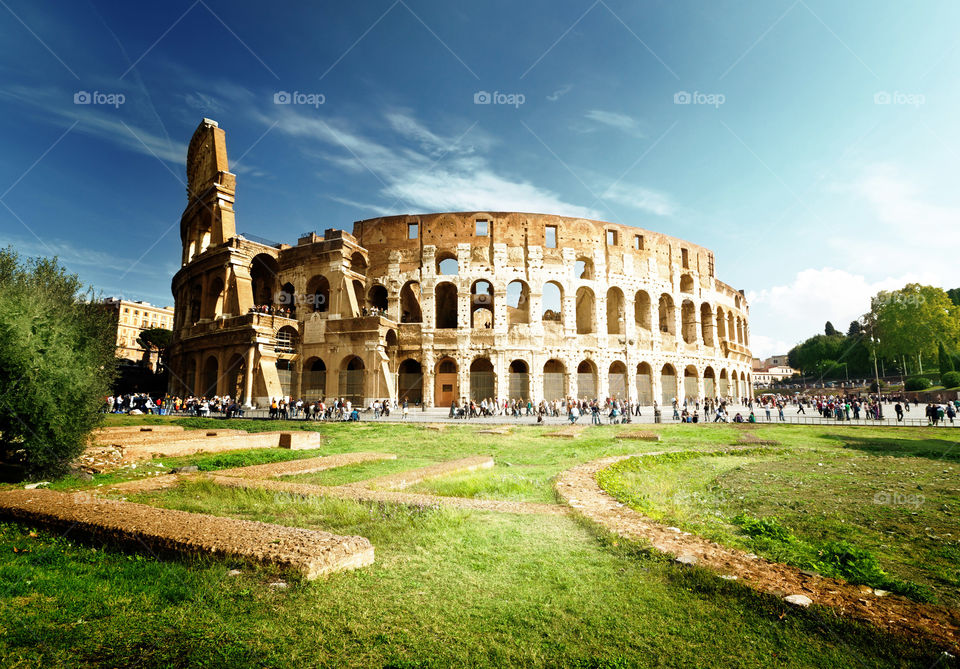 Colosseum in Rome with blurred crowd and color filter applied