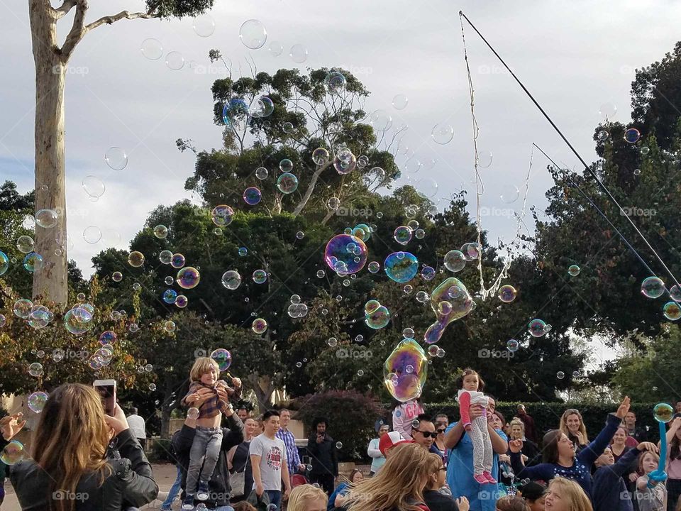 families having some fun with bubbles