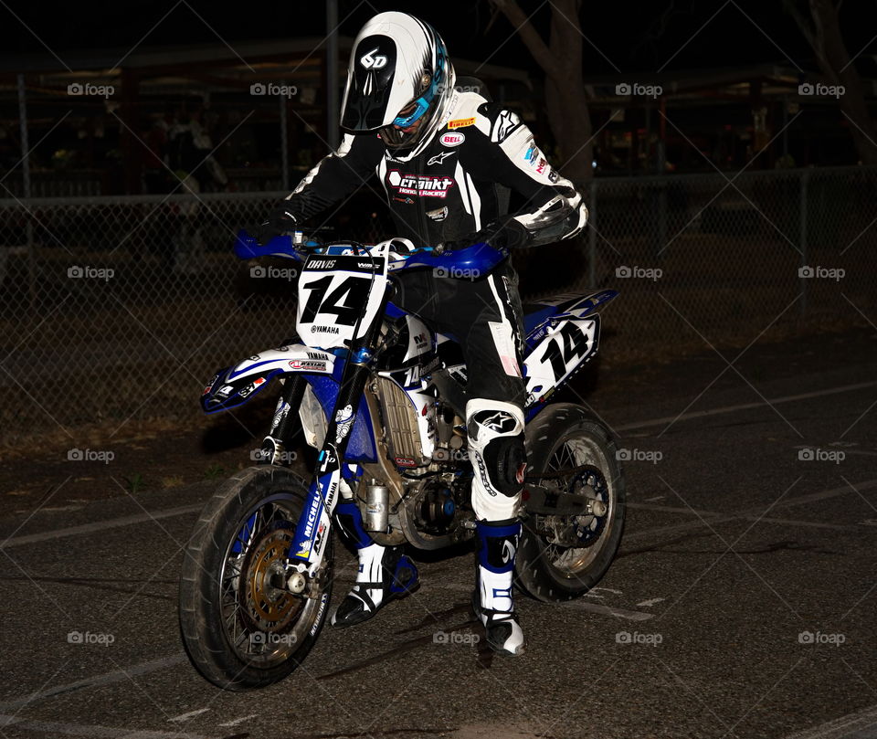 Supermoto  ride around the race track under lights