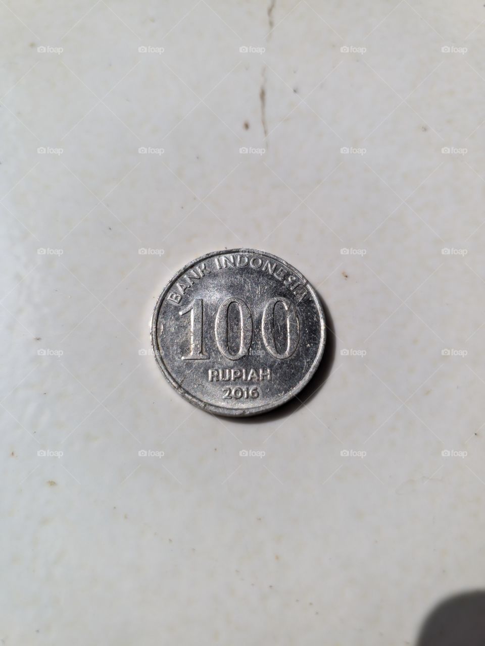 Indonesian currency rupiah coin one hundred rupiah