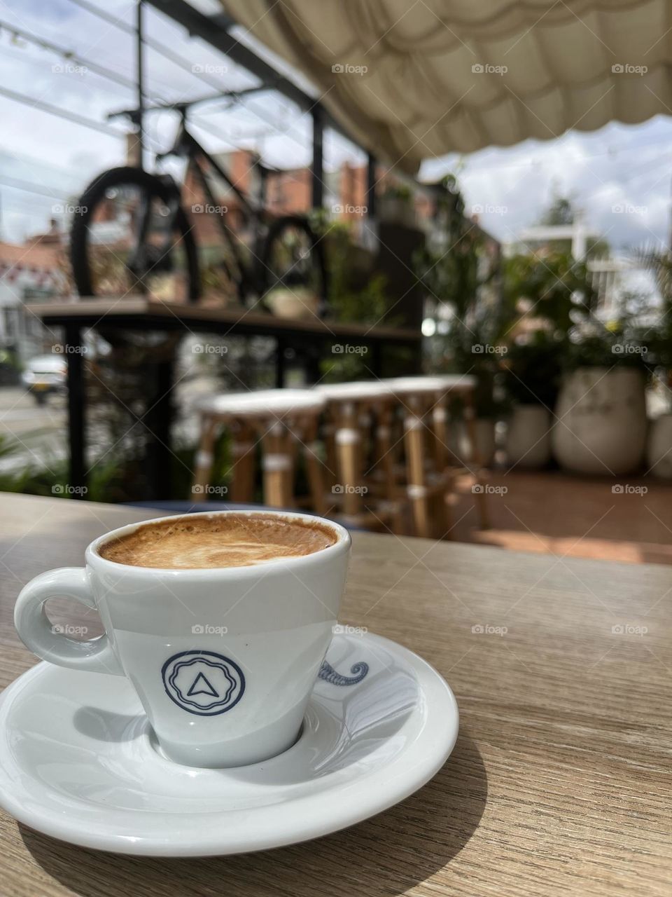 Some wood furniture at the cafe with a cup of coffee 