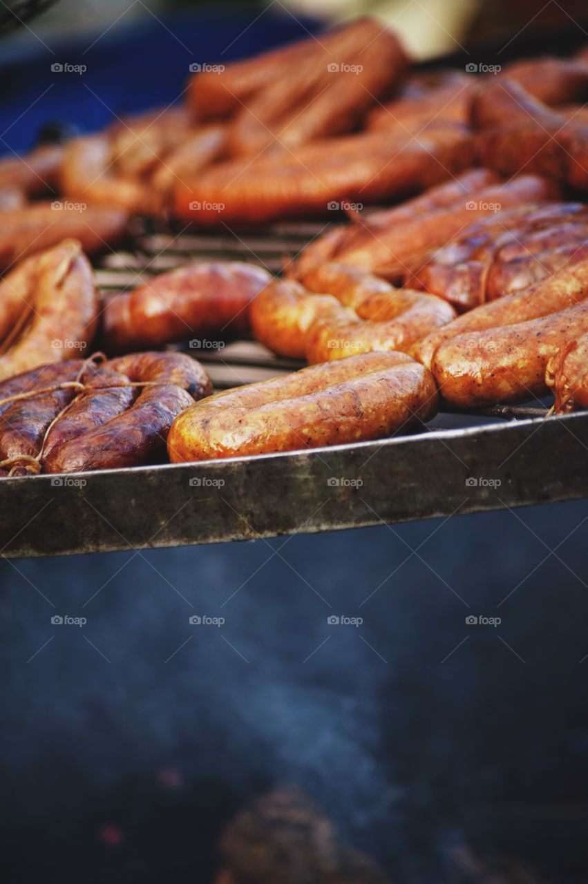 Food being prepared on barbecue grill