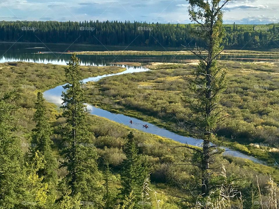 Kayaking on the river enjoying a beautiful sunny day