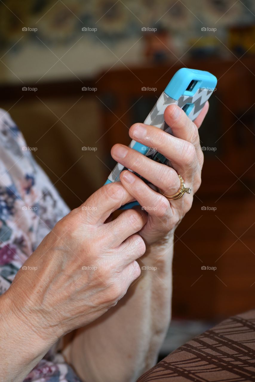 A Grandmother using a cell phone.