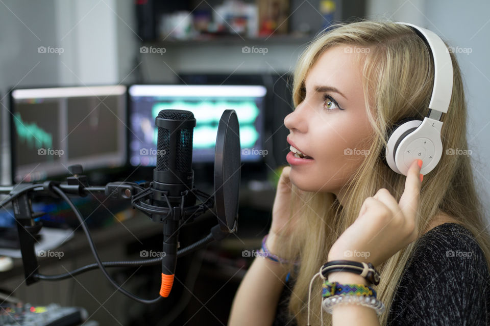 girl singing into a microphone