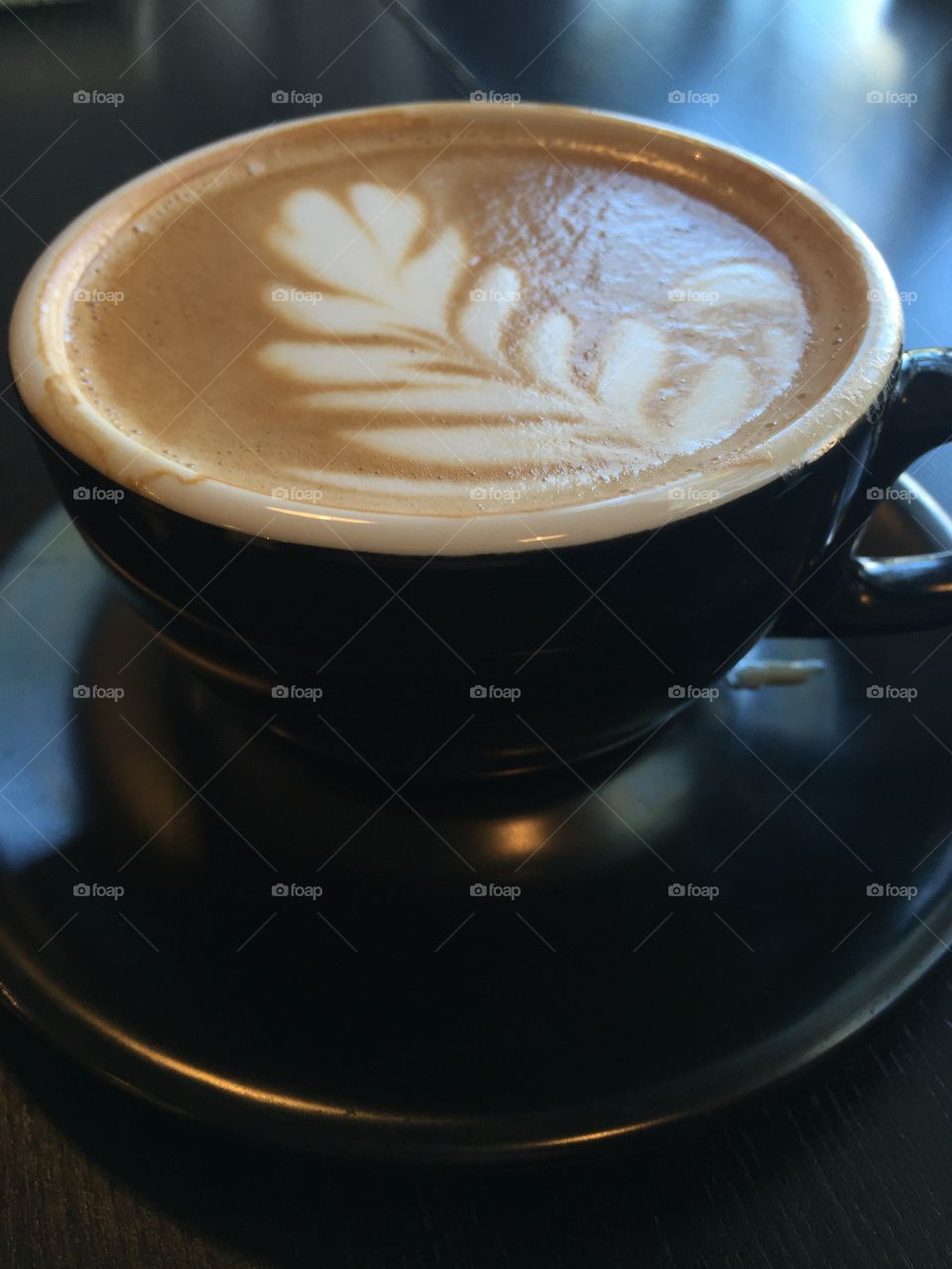 High angle view of coffee cup on table