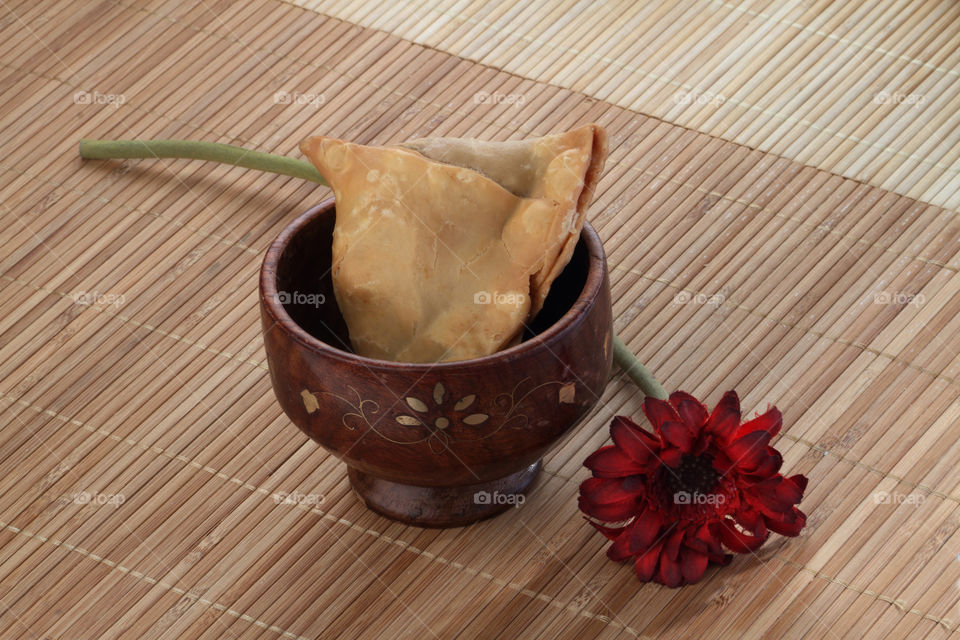 Indian spicy food samosa on wooden background