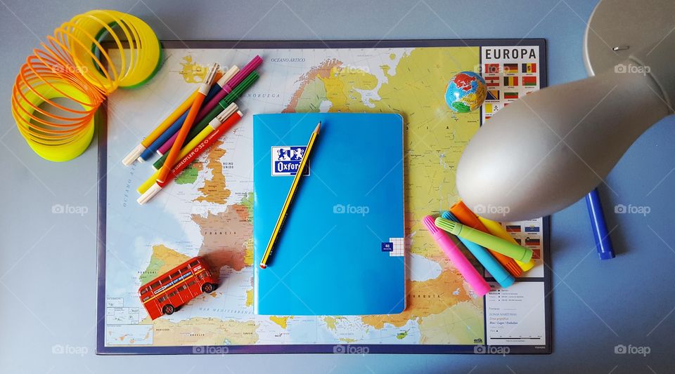 A young student's colourful desk.