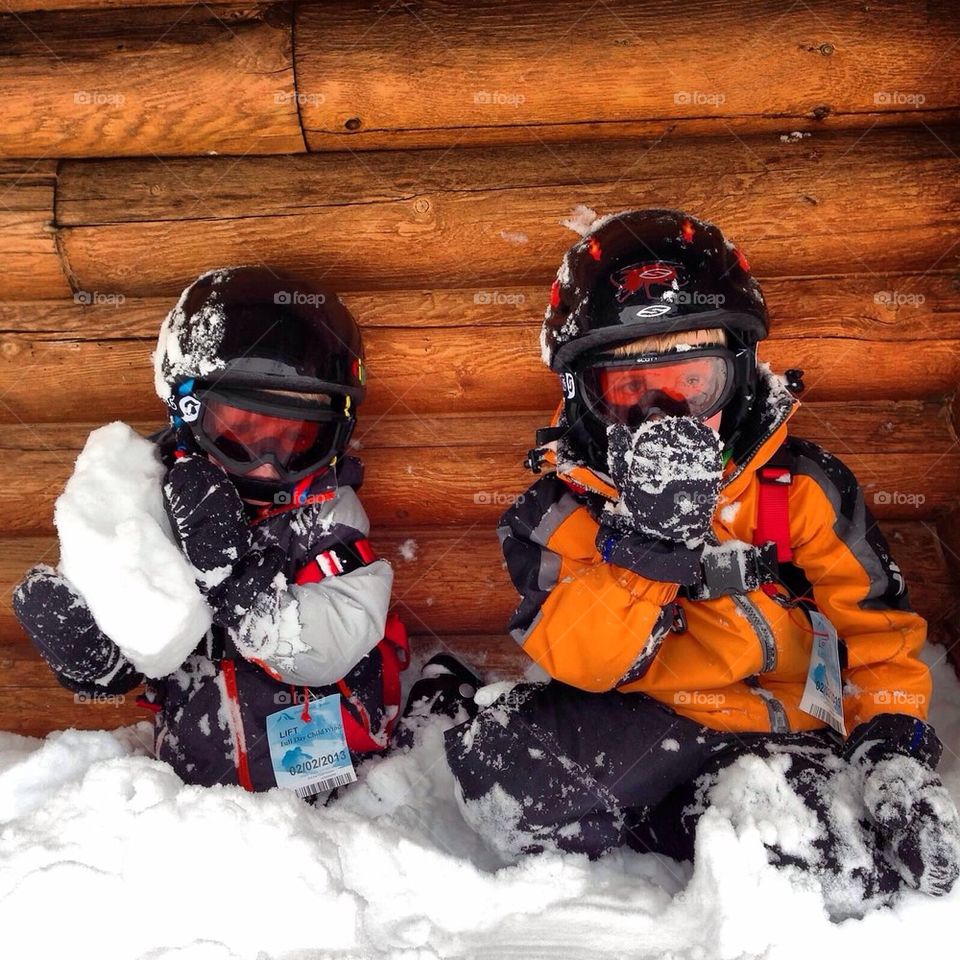 Tired skiing brothers