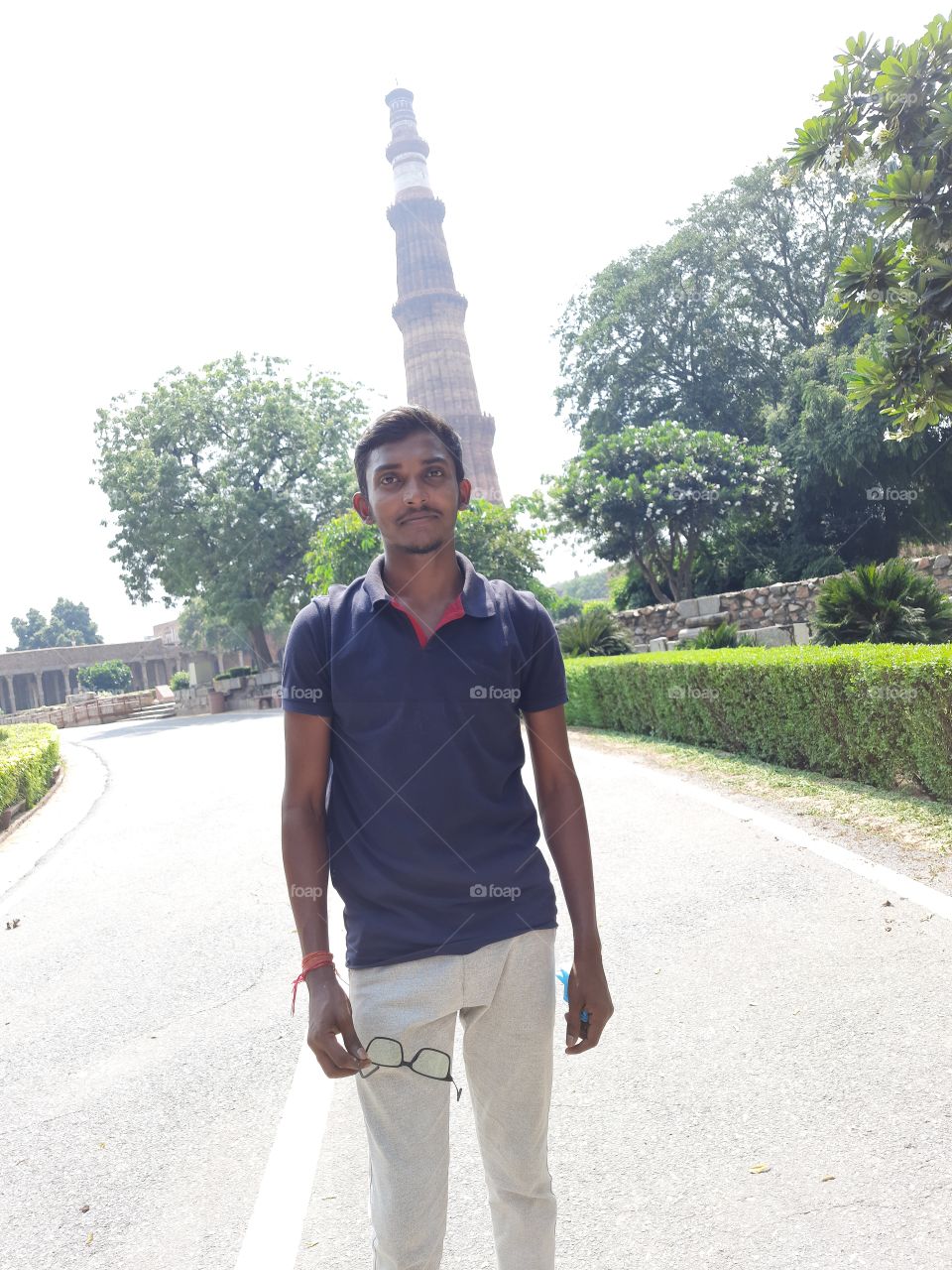 Picture with qutub minar in india.