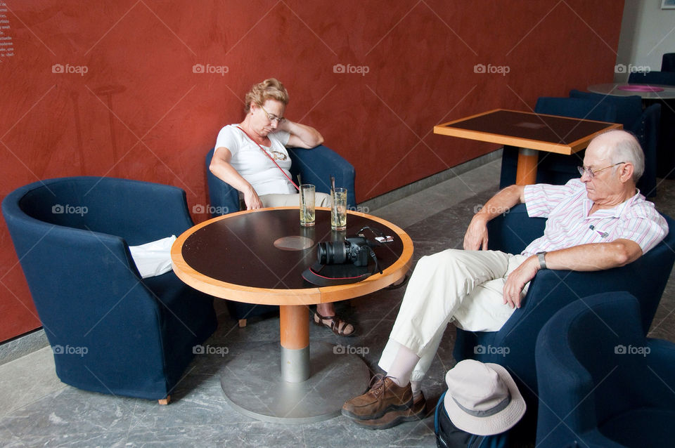 Elderly couple take a nap in the museum café in Lyon France